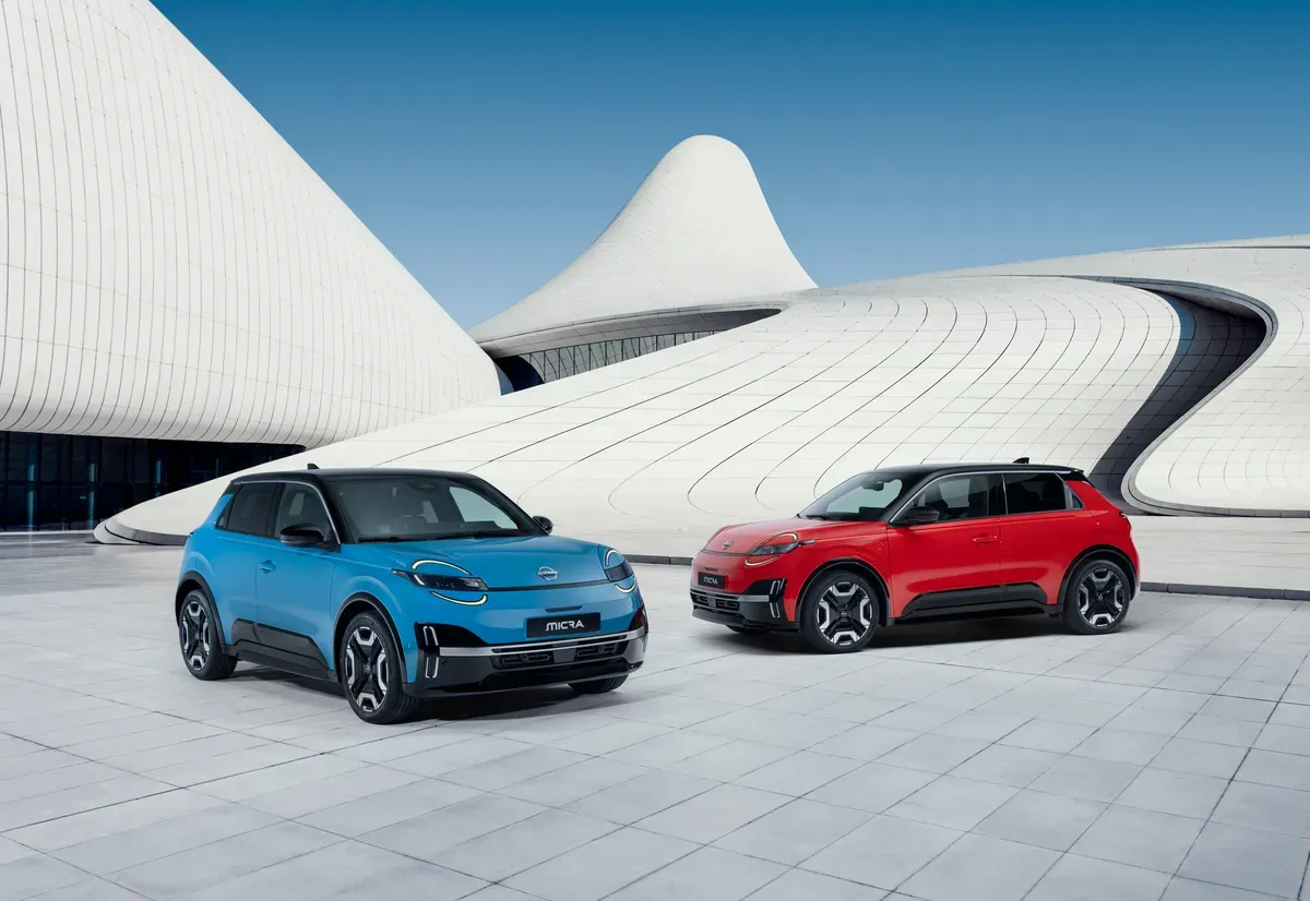 nissan Micra ev red and black standing together